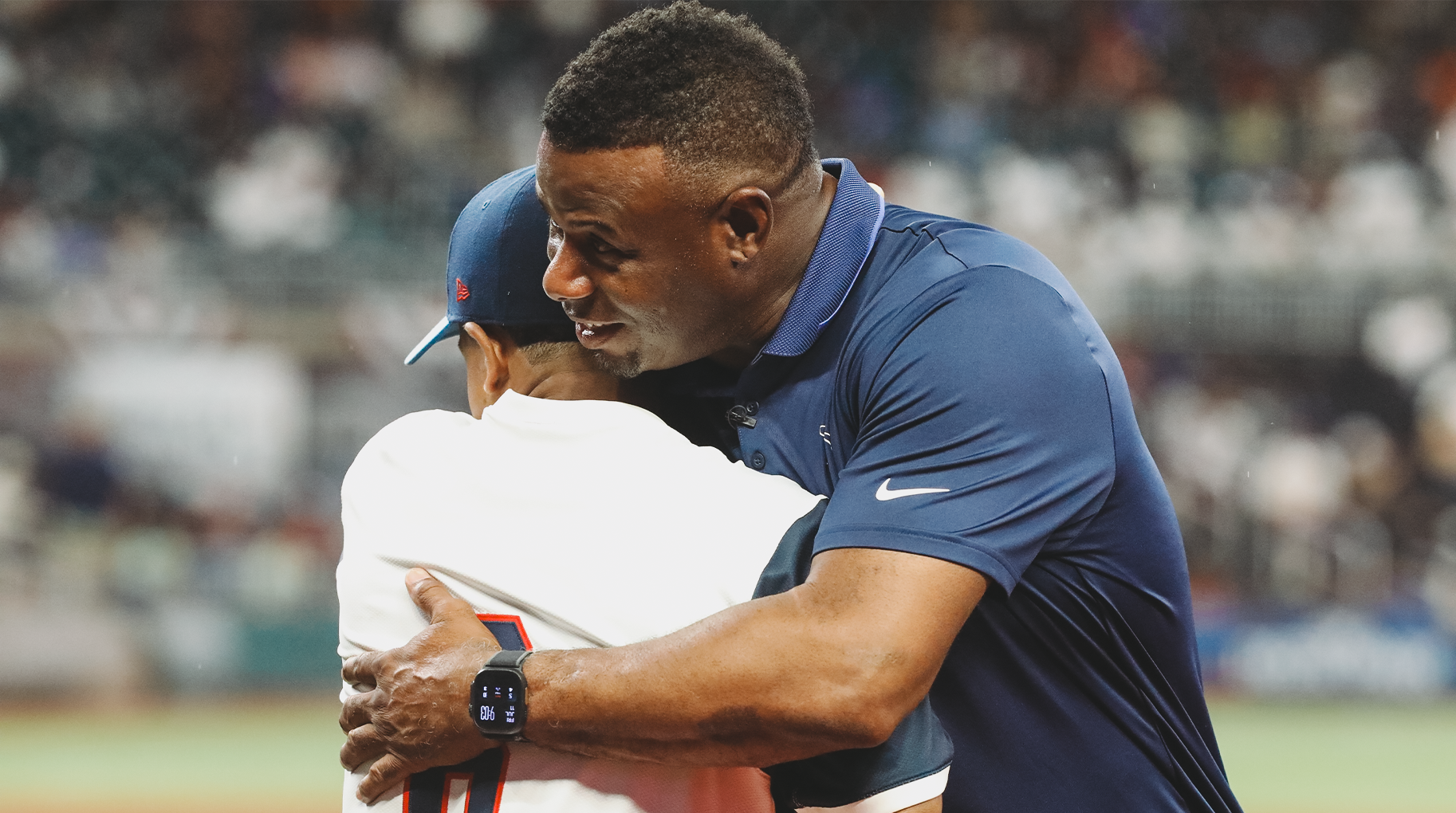 Pinckney and Ken Griffey, Jr. embrace.